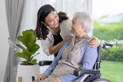elderly woman with caregiver
