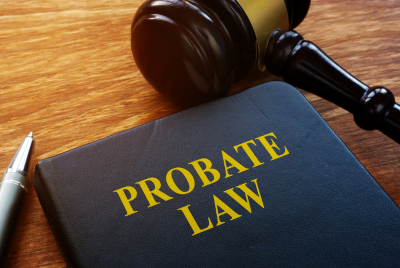 a gavel sitting next to a folder labelled "probate law"