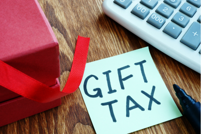 a sticky note with "GIFT TAXES" written on it
